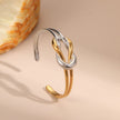 Brazalete Nudo en Oro 18k y Stain Steel